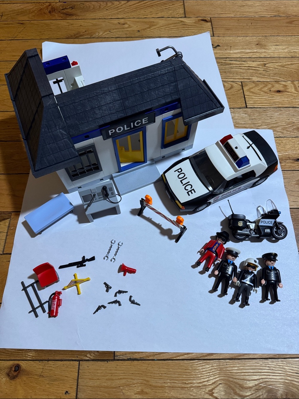 Playmobil police station, car, and motorcycle set